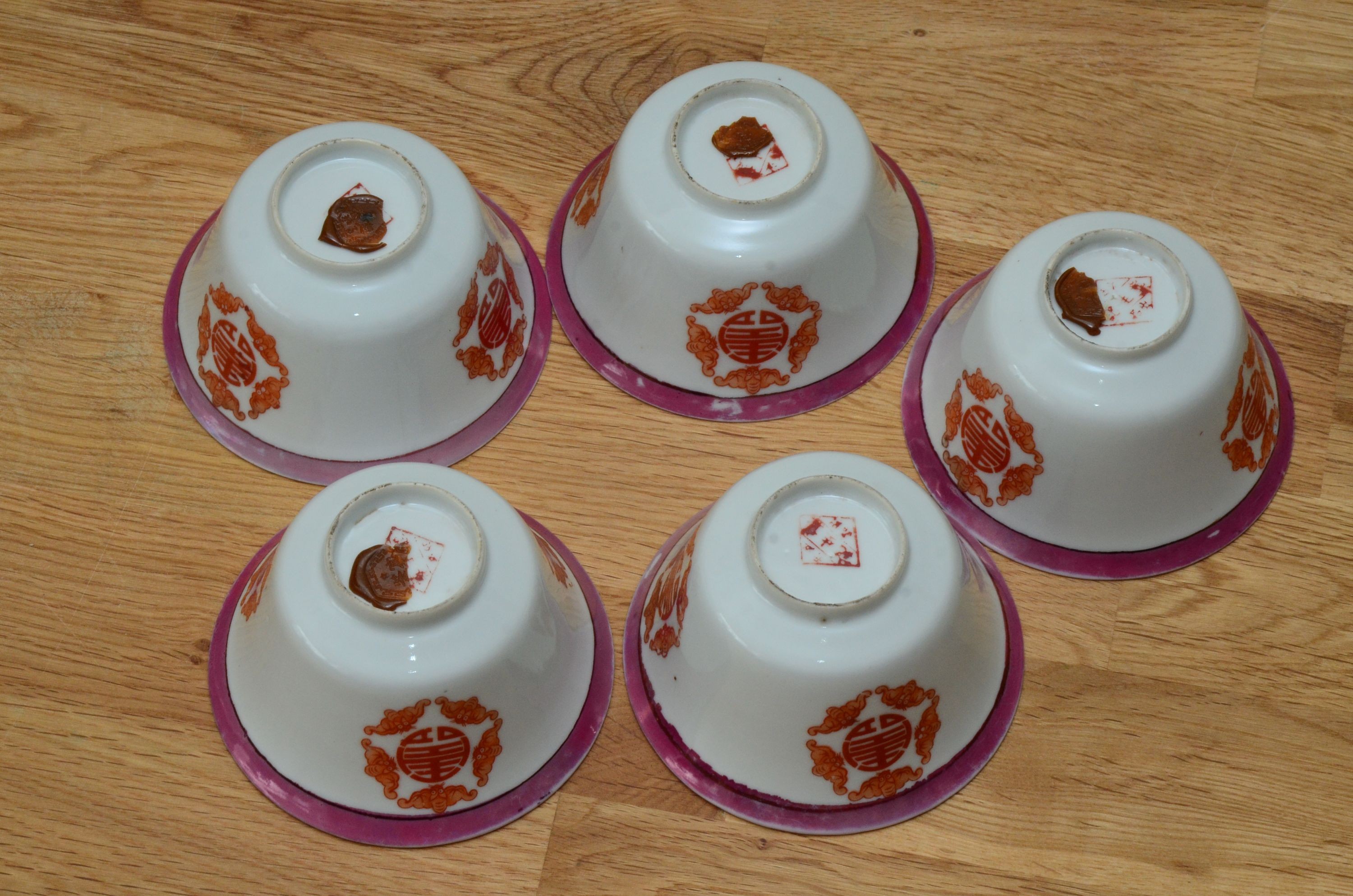 A set of five Chinese teabowls, covers and stands and a similar 'dragon' vase, 23cm